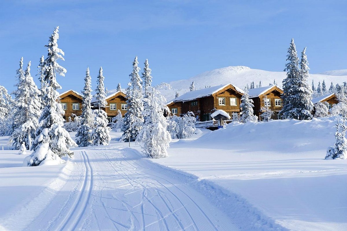 Hurdal in Norway - a snow covered road in front of a house.