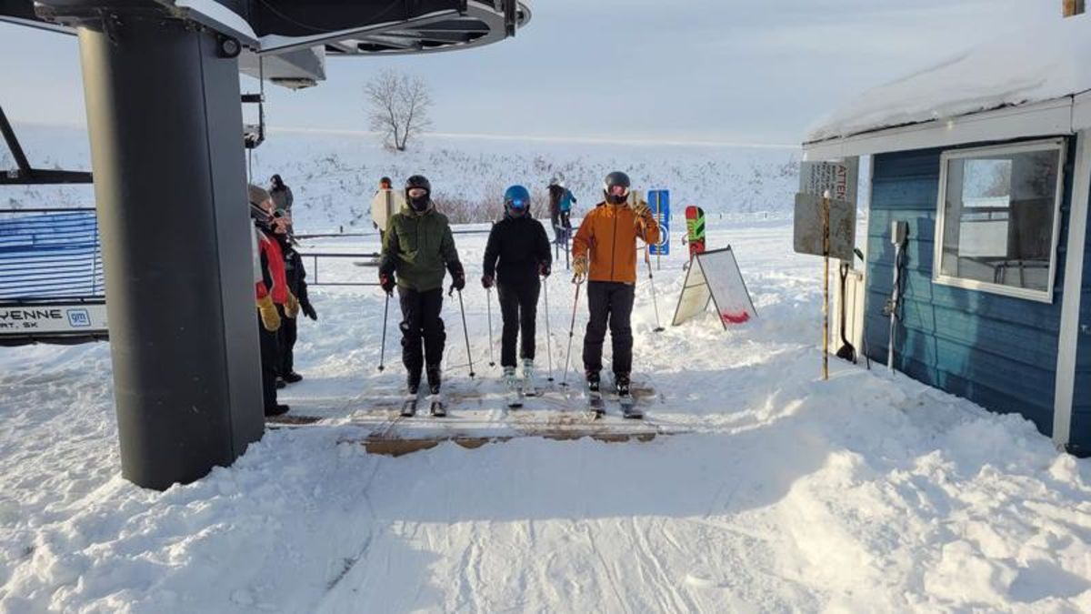 Wapiti Ski Hill – Elkford in Canada - a group of people standing on top of snow covered ground.