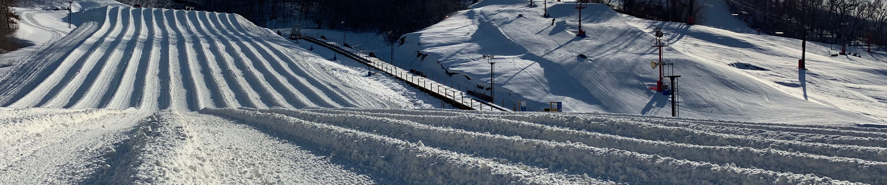 Snow Creek in USA - a ski slope covered in snow next to trees.