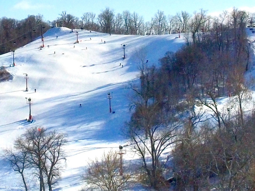 Snow Creek in USA - a group of people skiing down a snowy hill.