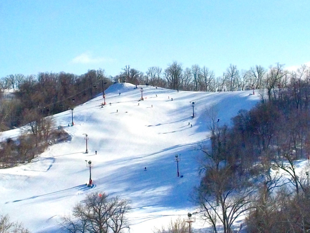 Snow Creek in USA - a group of people skiing down a snowy hill.