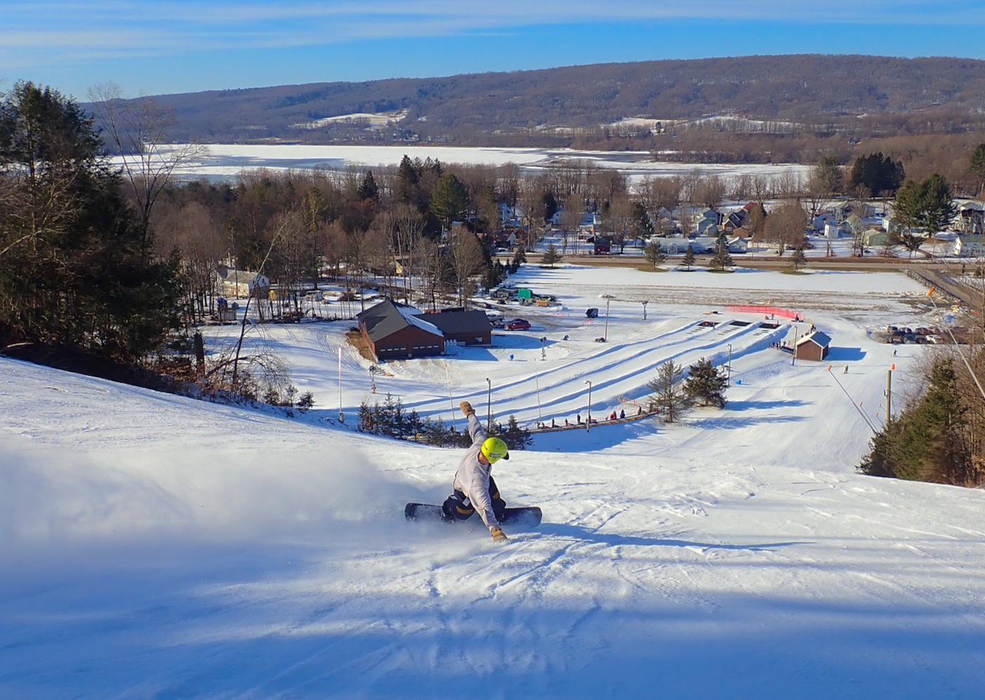 Woods Valley in USA - a person riding a snowboard down a hill.