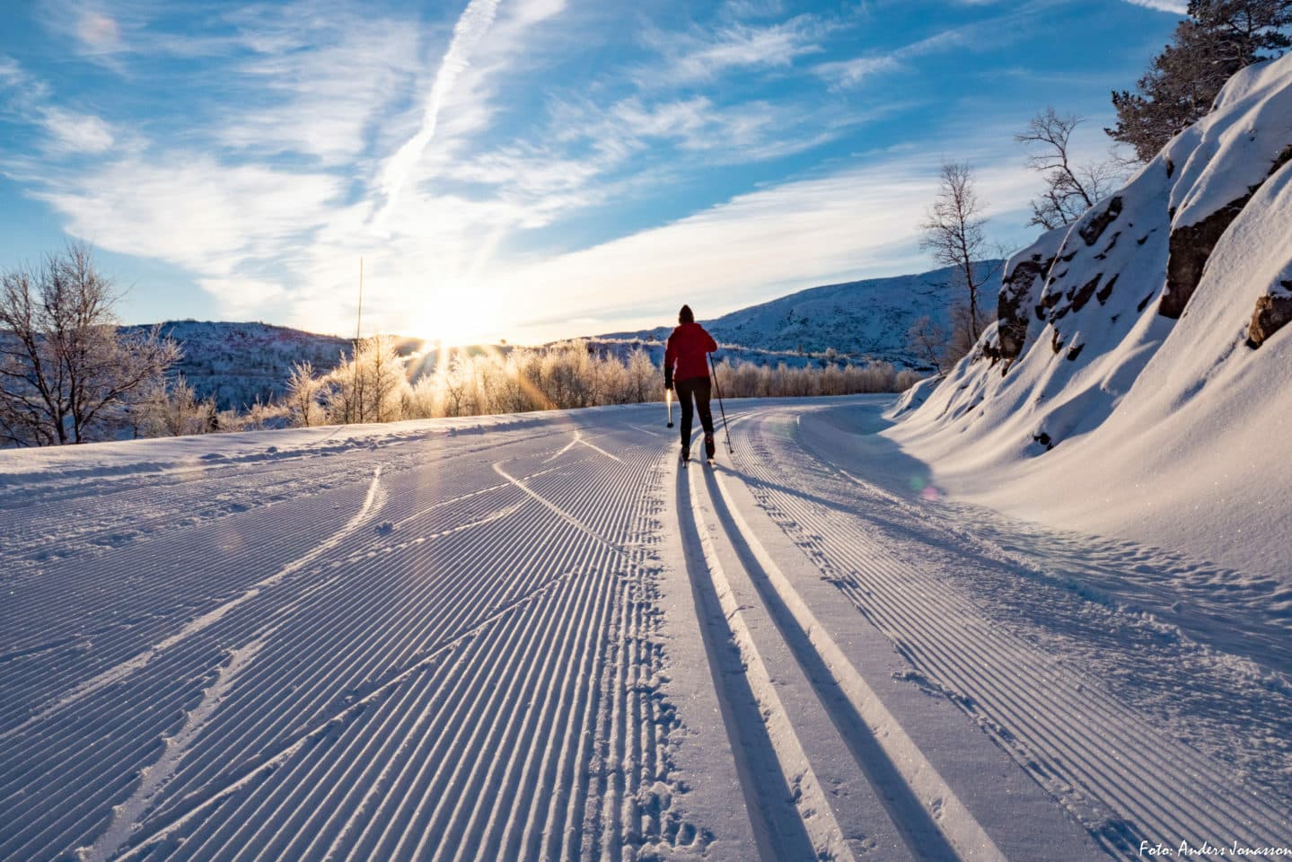 Brokke in Norway - a person walking down a snow covered road.