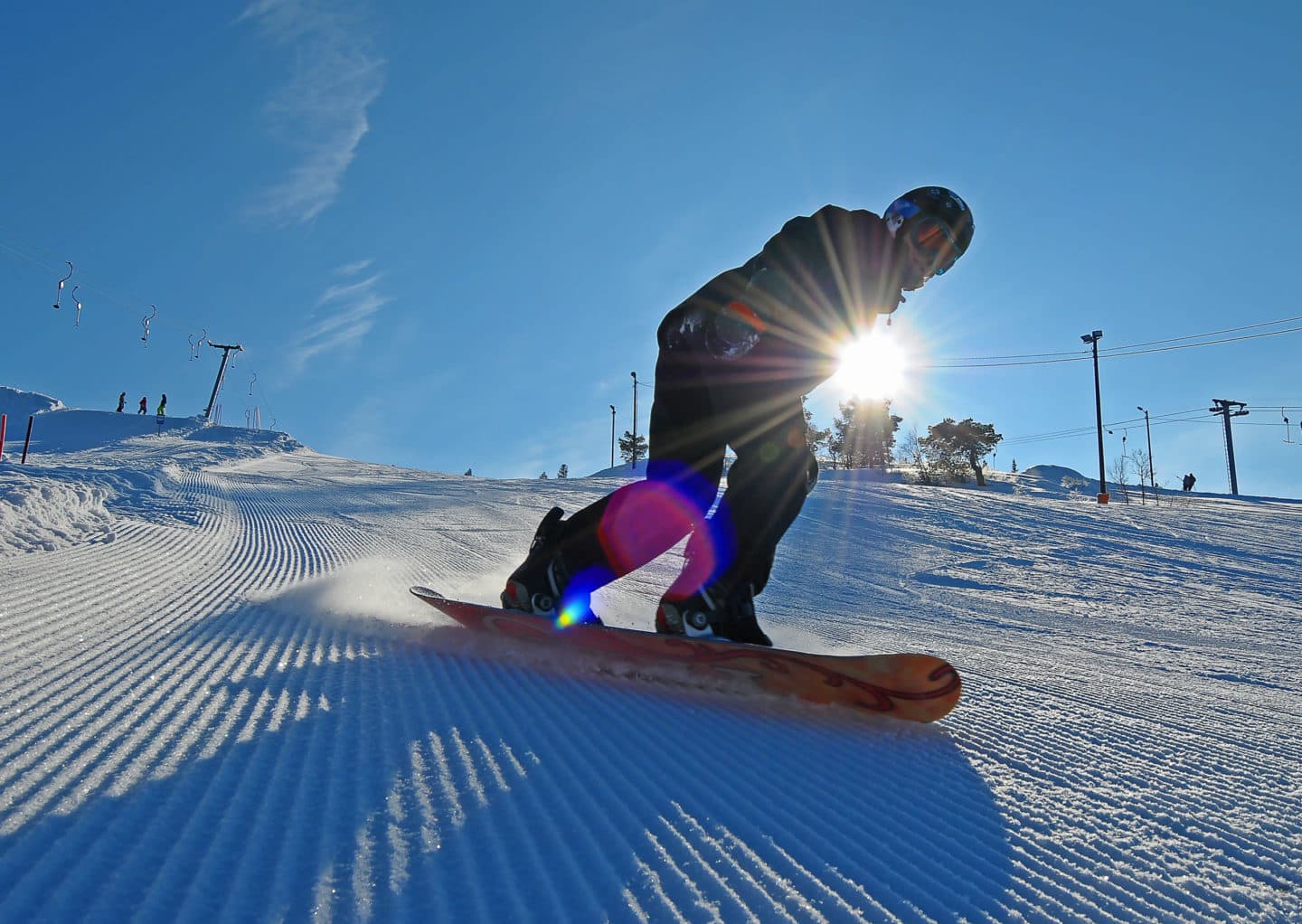 Brokke in Norway - a person on a snowboard going down a hill.