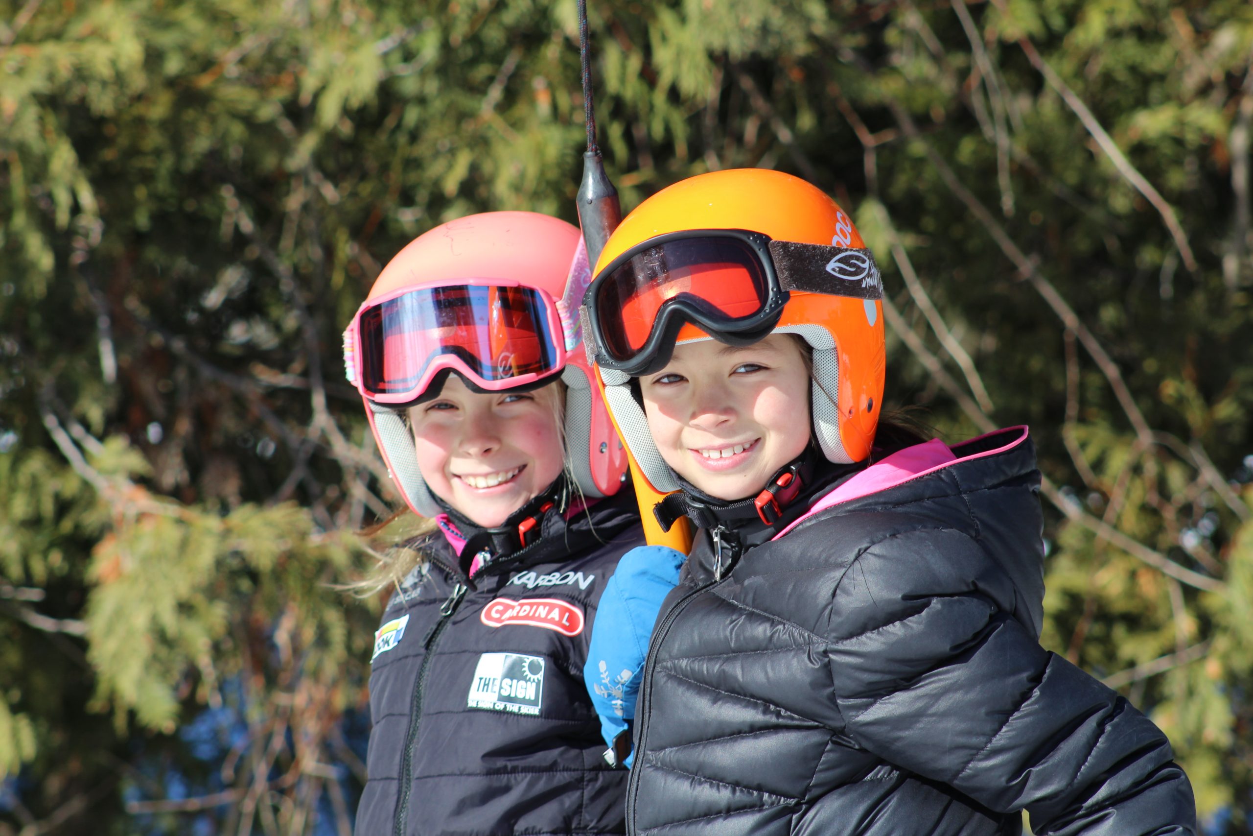 Mansfield Ski Club in Canada - two girls in ski gear posing for a picture.