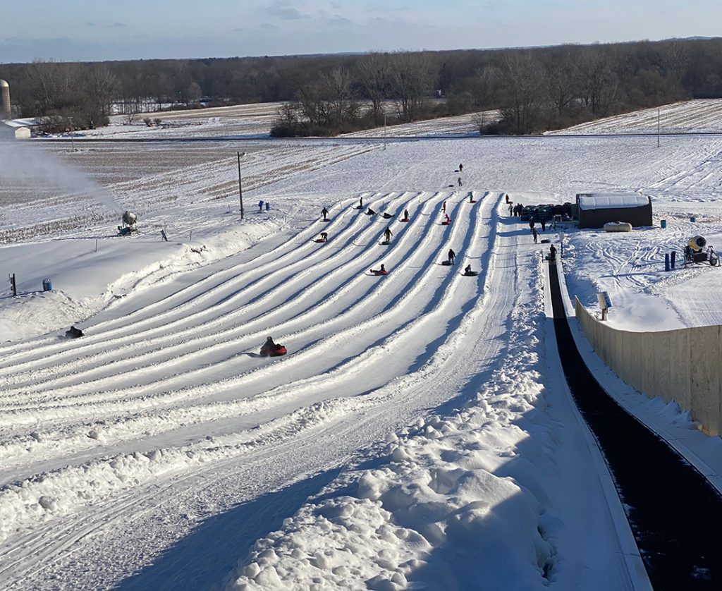 Timber Ridge in USA - a snow covered field with people on it.
