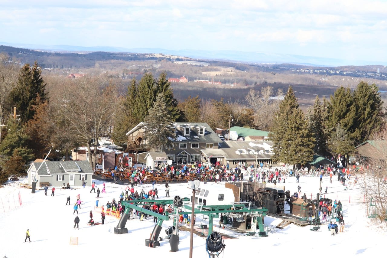 Mount Peter in USA - a group of people skiing down a hill.