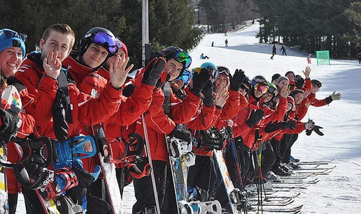 Mount Peter in USA - a group of people standing on top of a ski slope.