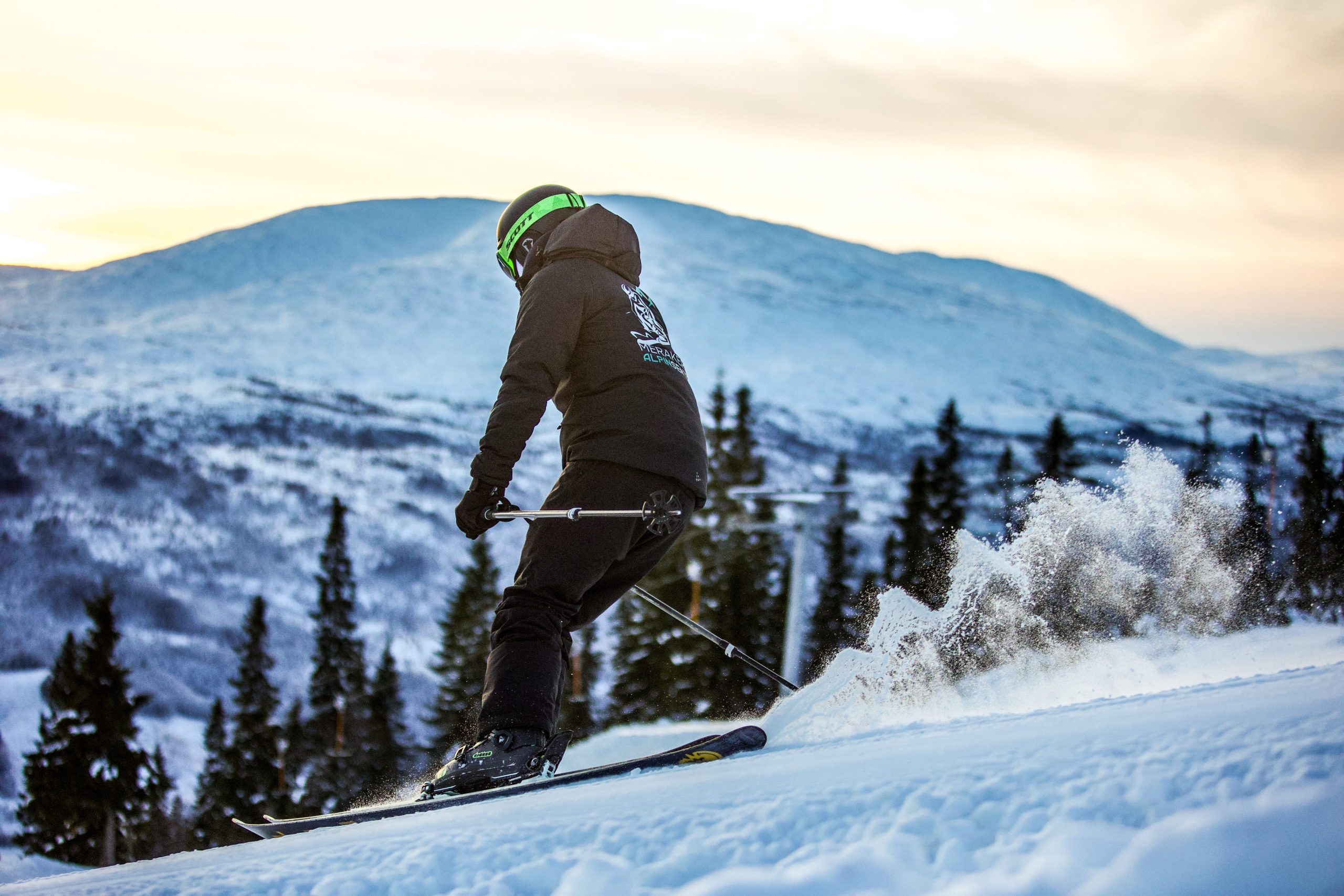 Meråker Alpinsenter in Norway - a man riding skis down a snow covered slope.