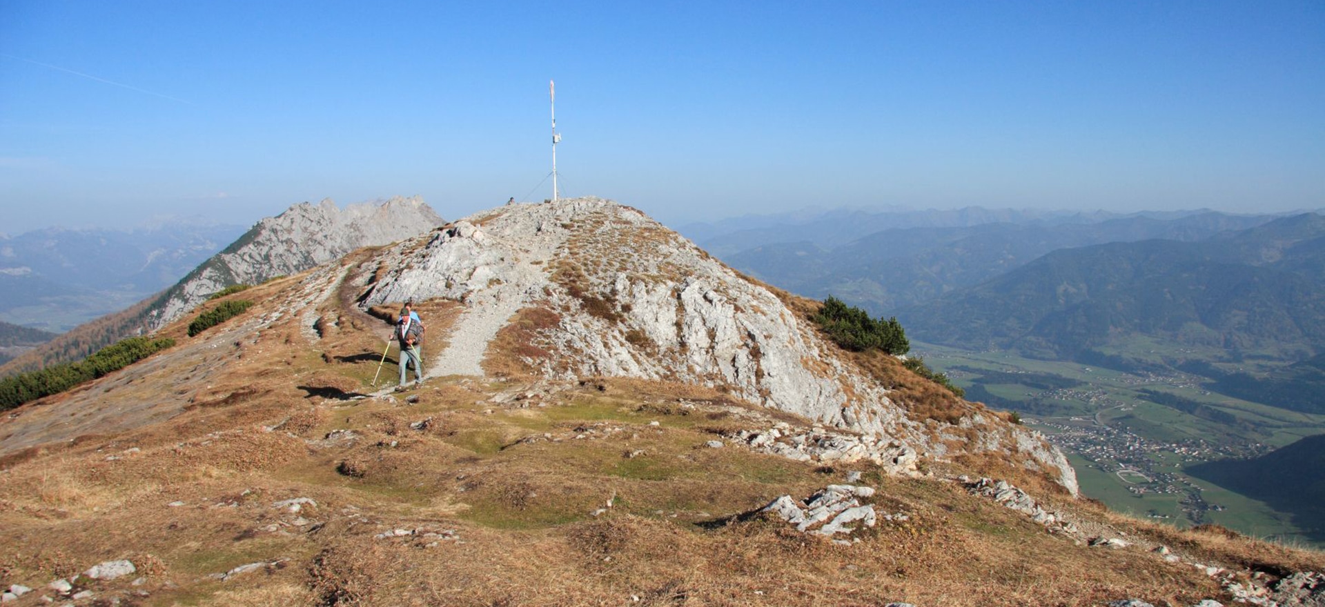 Stoderzinken – Gröbming in Austria - a person standing on top of a mountain.