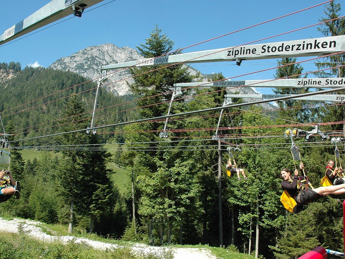 Stoderzinken – Gröbming in Austria - a group of people riding on a ski lift.