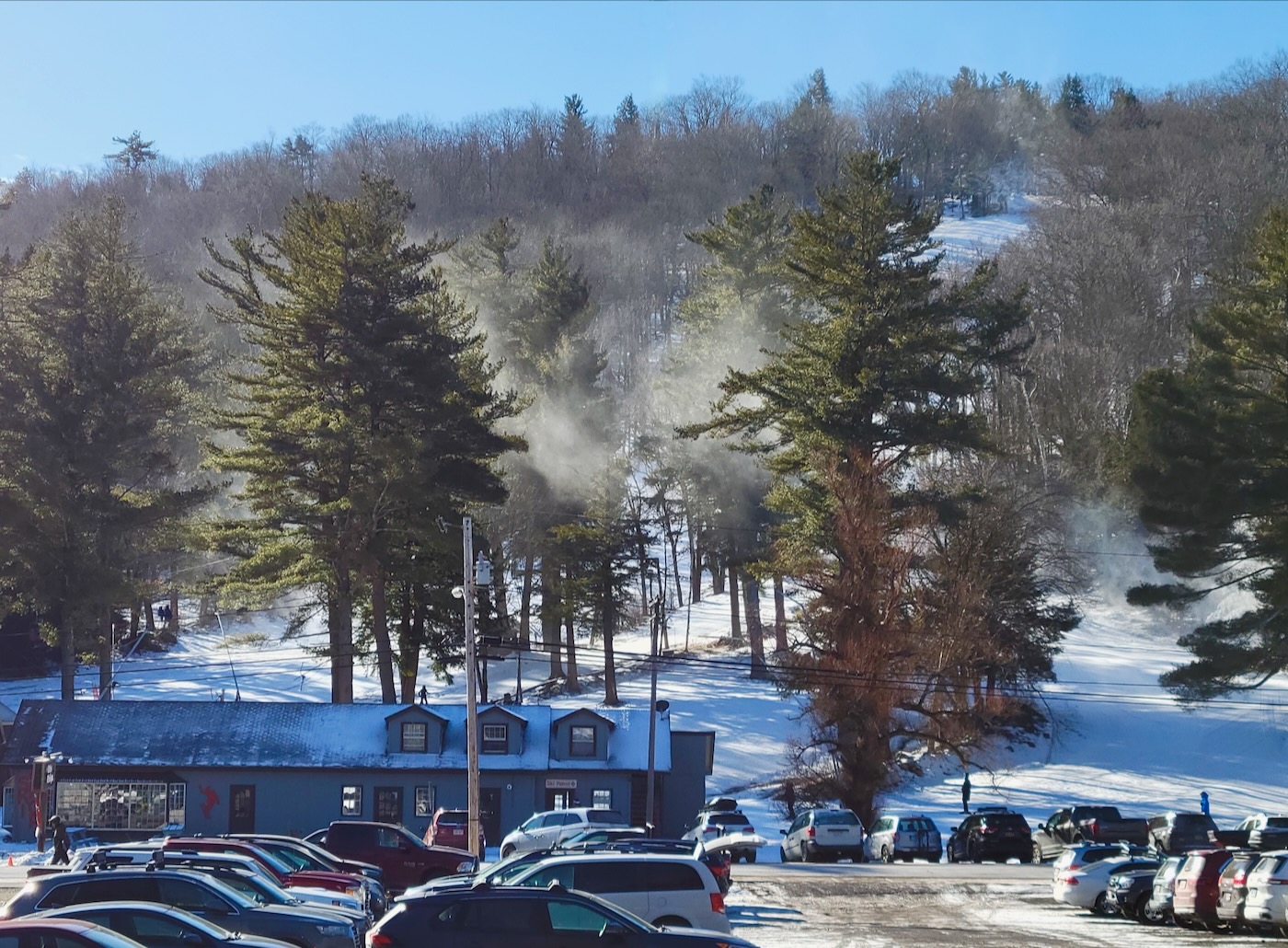 Otis Ridge in USA - a parking lot with cars parked in the snow.