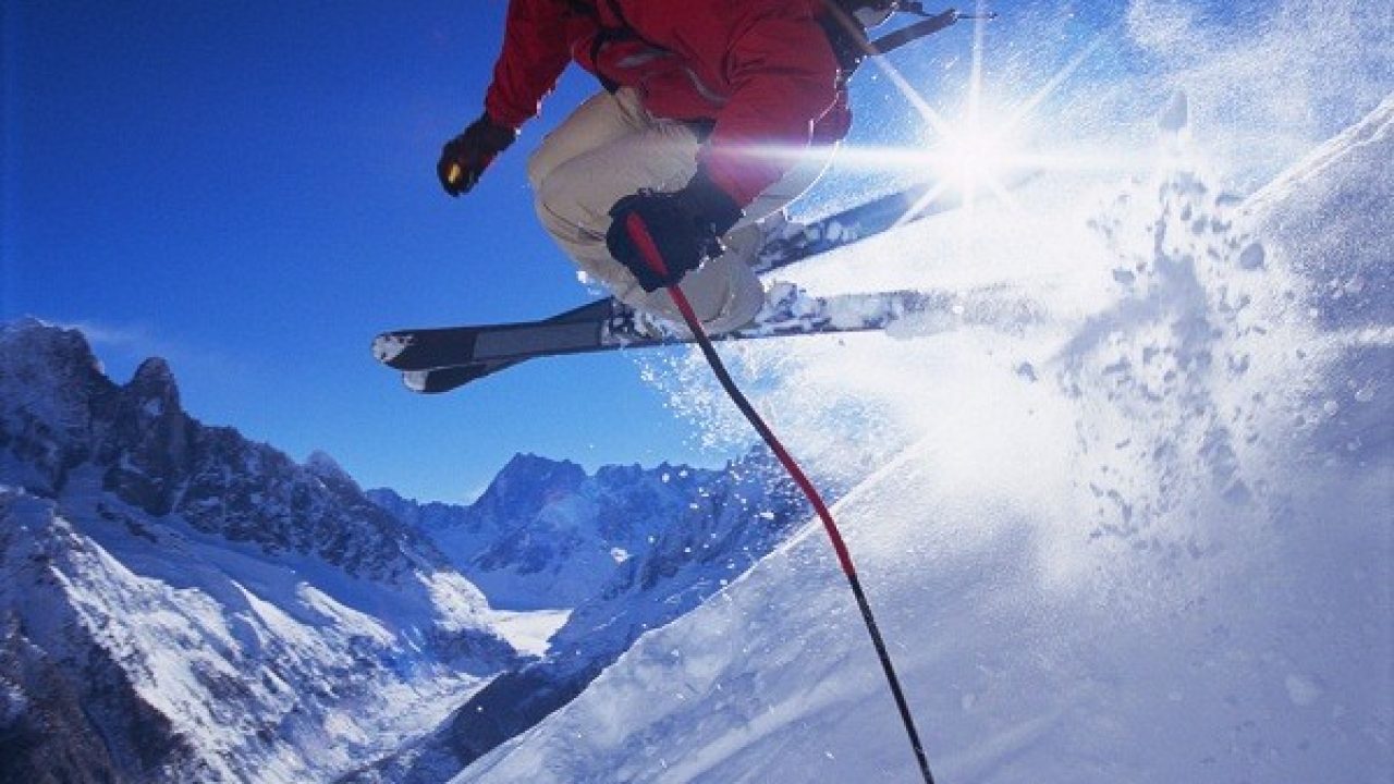 Mogosa in Romania - a person jumping in the air on skis.