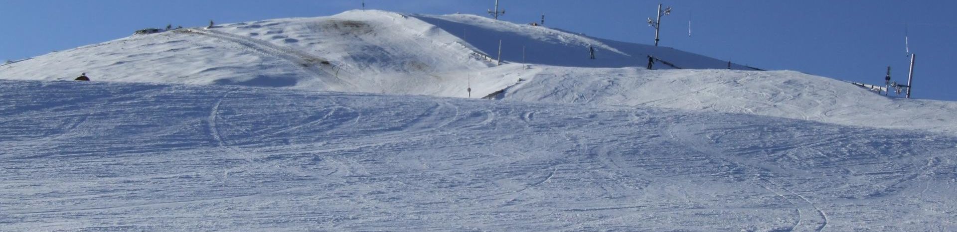 Králiky in Slovakia - a snow covered mountain with ski equipment on it.