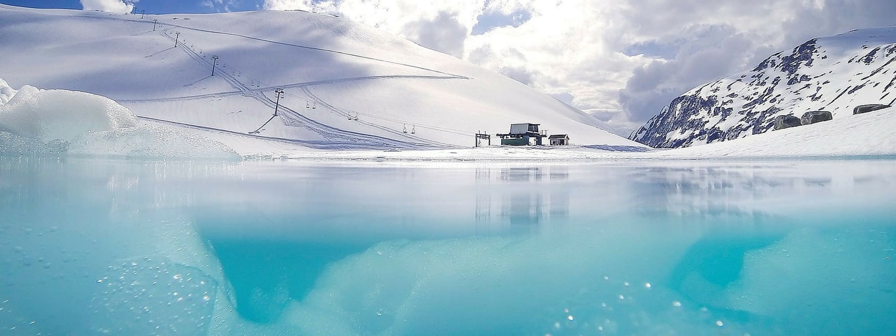 Stryn Sommerski – Tystigbreen in Norway - a large body of water surrounded by ice.