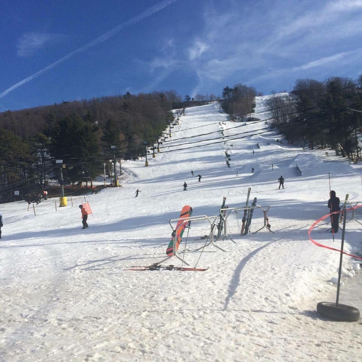 Tussey Mountain in USA - a ski slope with people skiing down it.