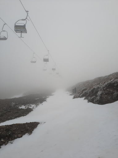 Bruncu Spina in Italy - a ski lift going up a snowy mountain.