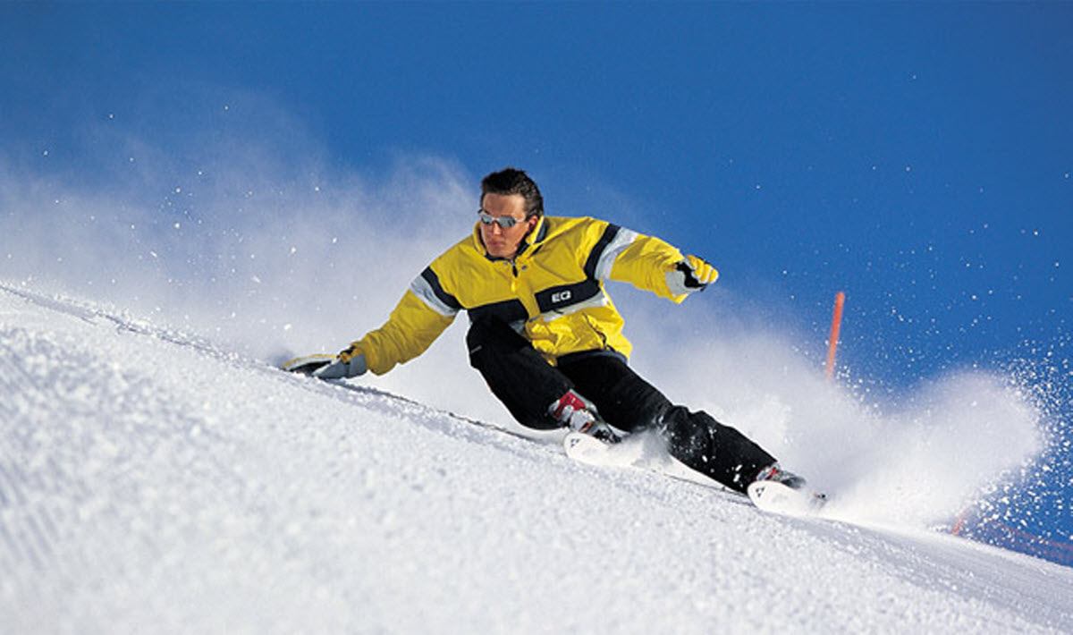 Arber in Germany - a man riding a snowboard down a slope.