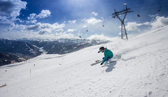 Sillian – Thurntaler in Austria - a person riding a snowboard down a snowy slope.