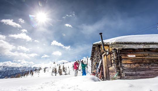 Sillian – Thurntaler in Austria - a group of people skiing down a snowy slope.