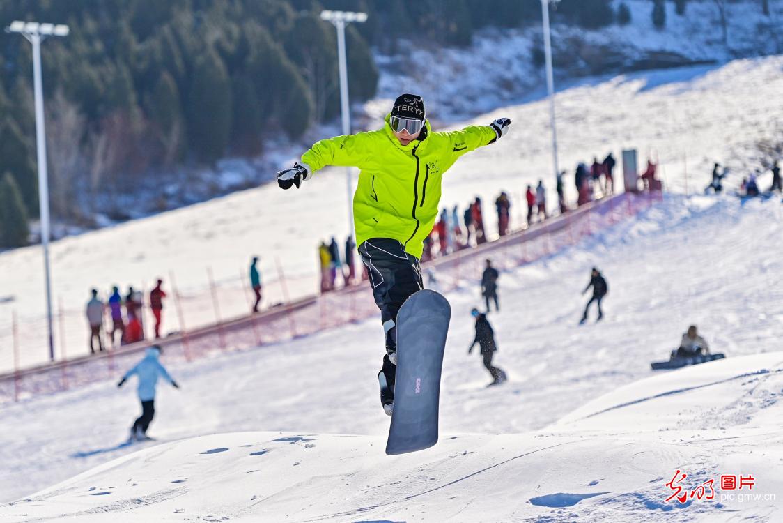 Jinlongshan – Zhalantun in China - a snowboarder in the air.