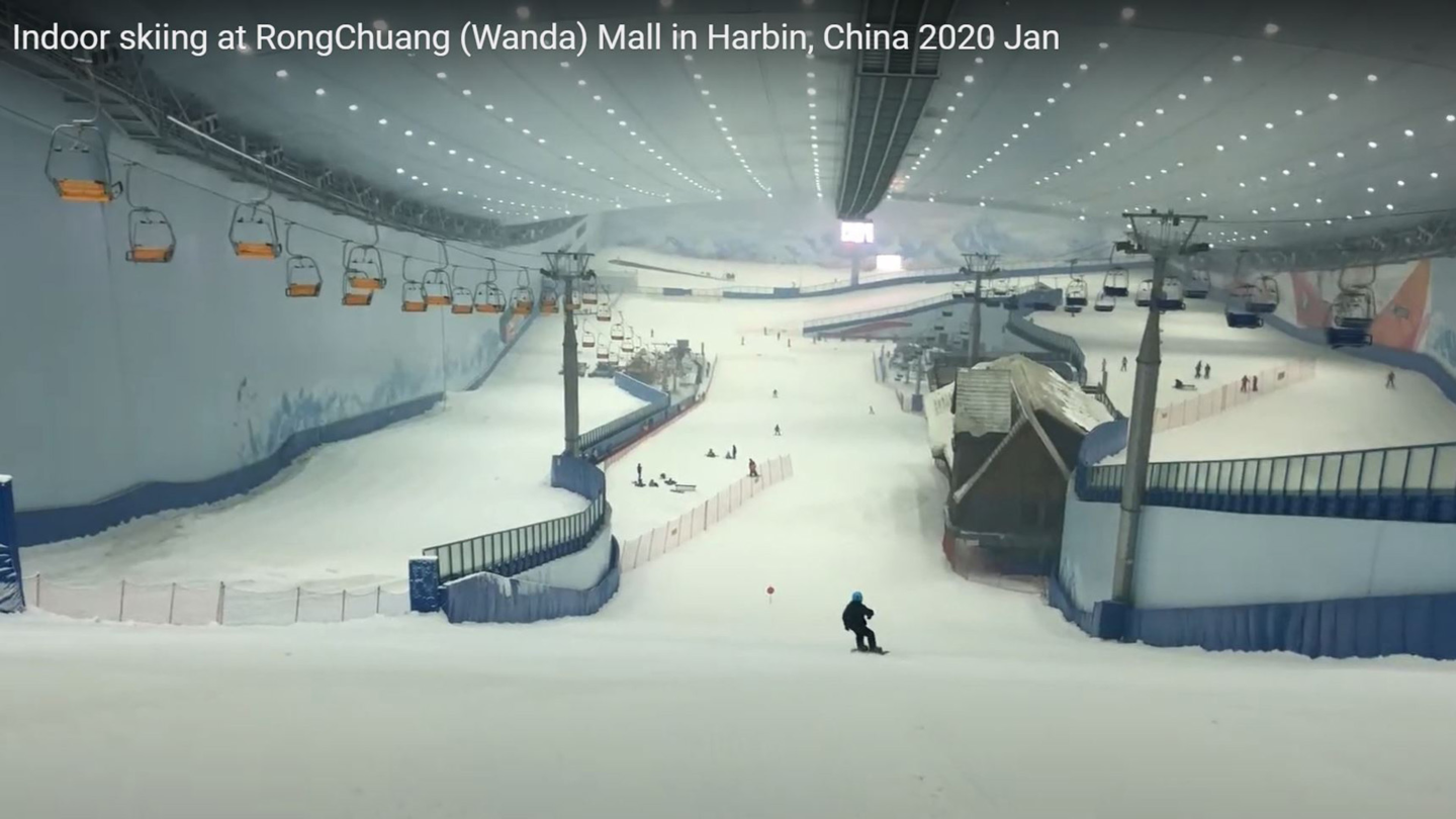Wanda Harbin Mall in China - a snowboarder is going down the hill.