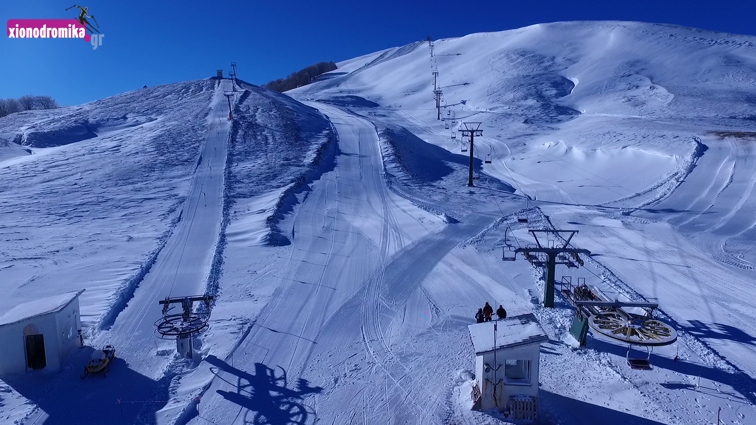 Anilio in Greece - a ski slope covered in snow with a ski lift.