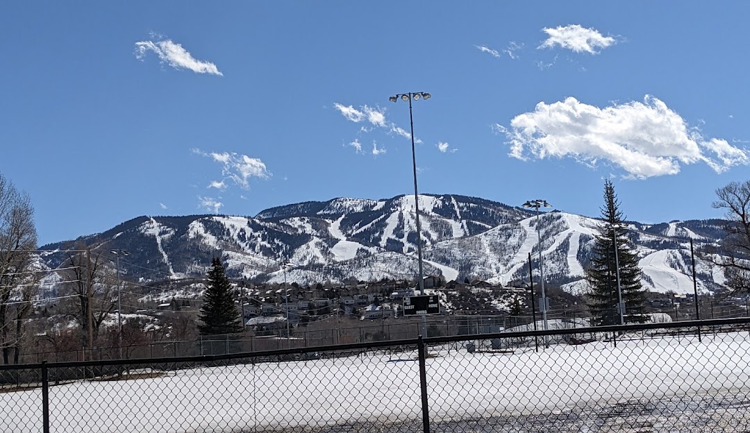 View of Howelsen Hill at Steamboat Springs, Colorado, showcasing a stunning snowy mountain scenery, part of a winter sports complex popular for skiing.