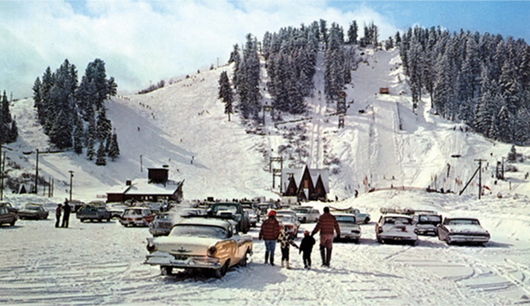 Winter sports scene at Howelsen Hill, Steamboat Springs, Colorado featuring a ski resort complete with a ski lift, against a breathtaking winter backdrop.