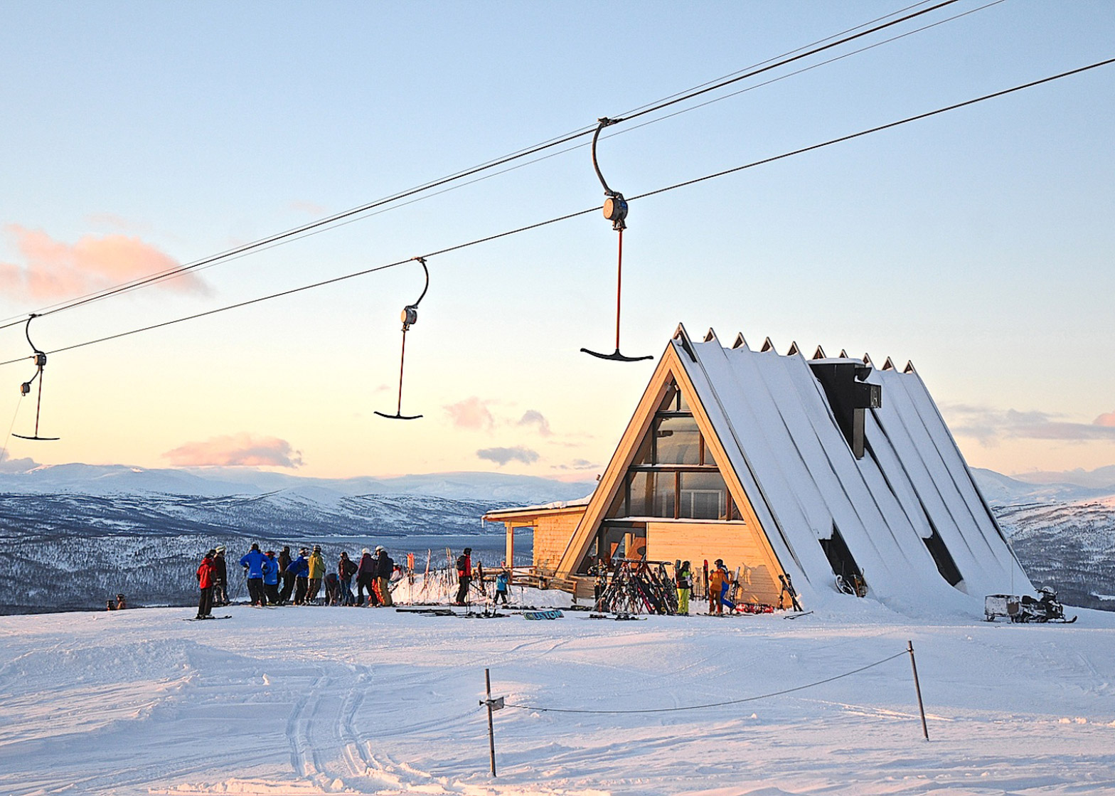 Hemavan in Sweden - a group of people standing on top of a snow covered mountain.