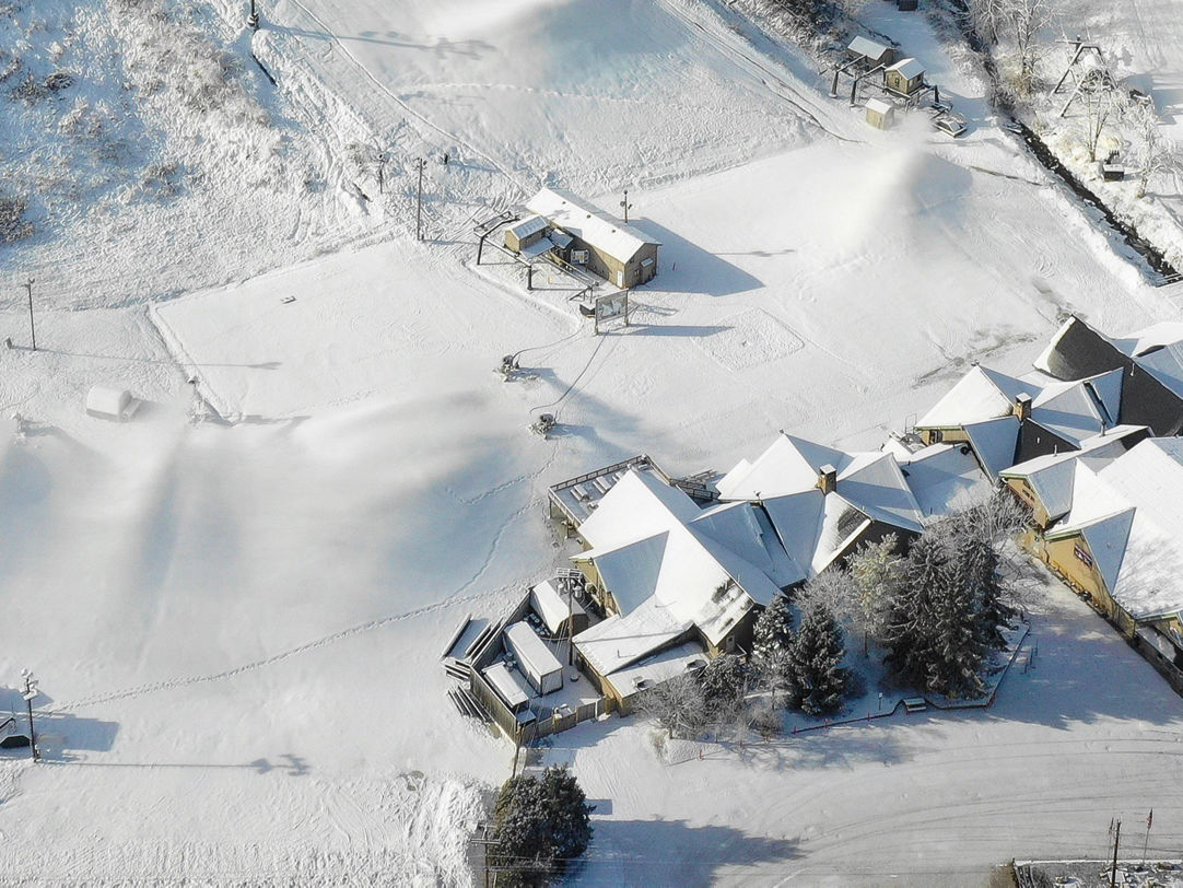 Boston Mills in USA - an aerial view of a house in the snow.