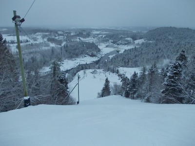 Mont Fortin in Canada - a ski lift going down a snowy hill.