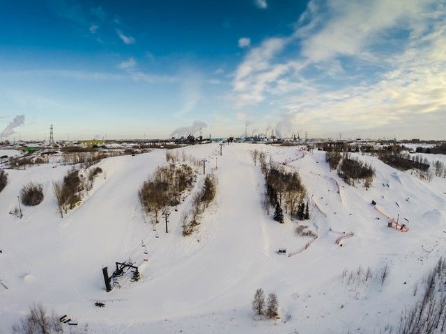 Winter sports scene at Sunridge in Edmonton Capital Region, Canada featuring a ski resort with a ski lift and snow-covered slopes.
