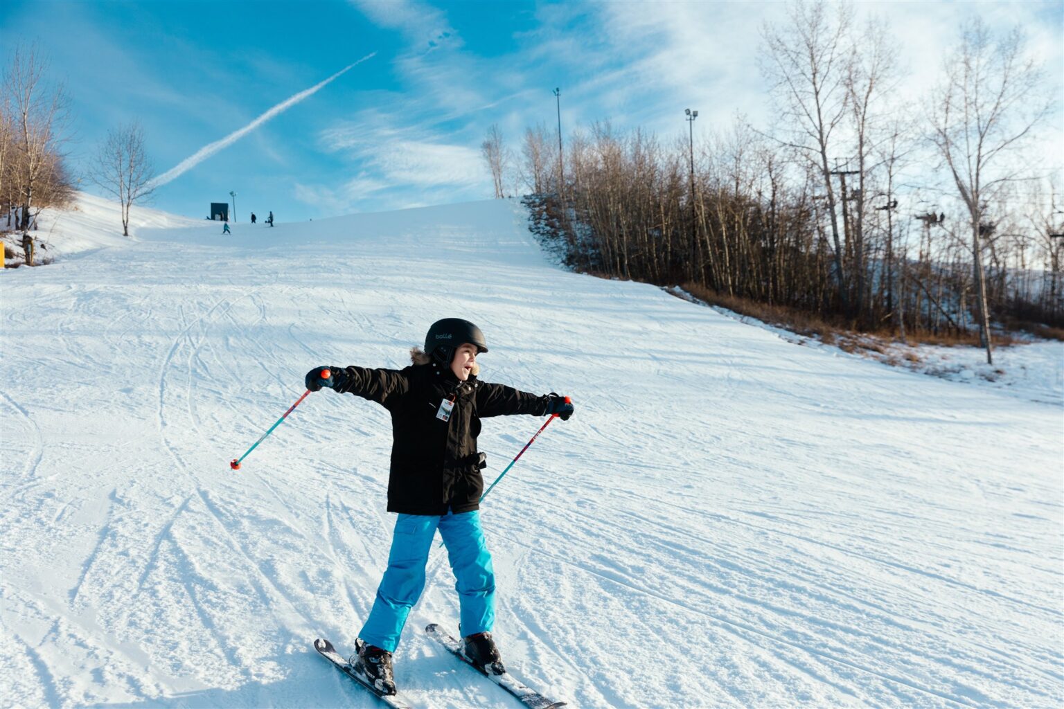 Sunridge in Canada - a young boy is skiing down a hill.