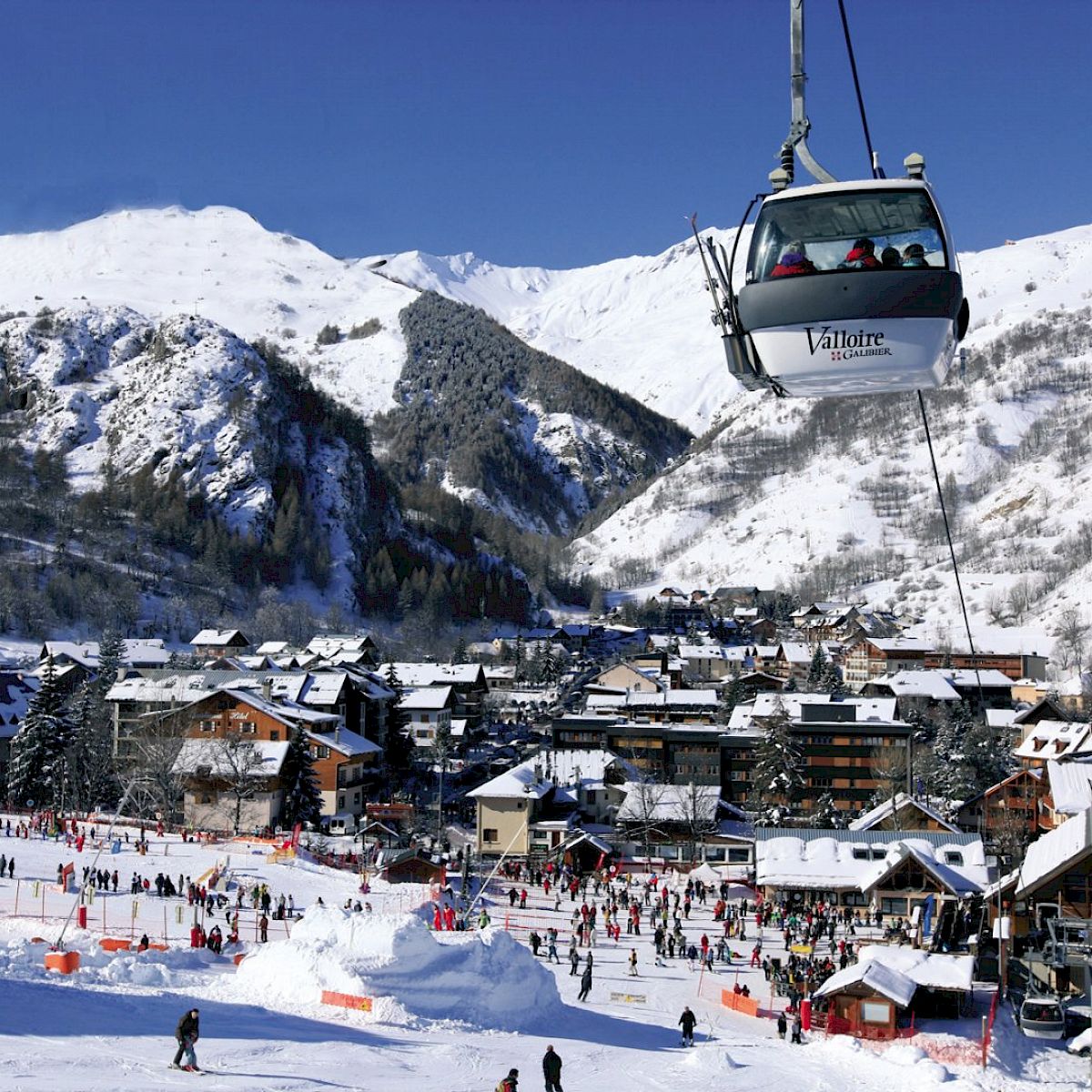 Ski resort Valloire - Galibier-Thabor in France: a ski resort with people skiing on the slopes.