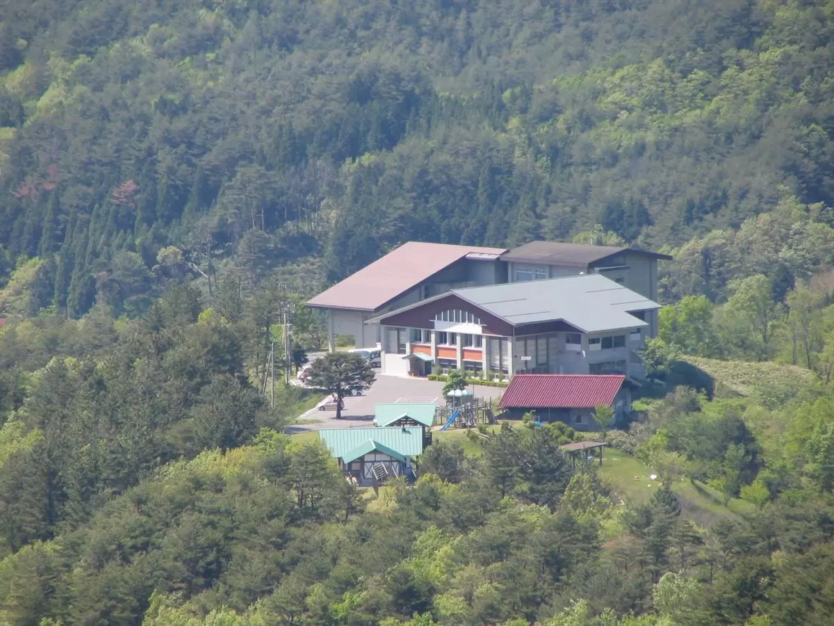 Tsuguro Kogen in Japan - a house in the middle of a forested area.
