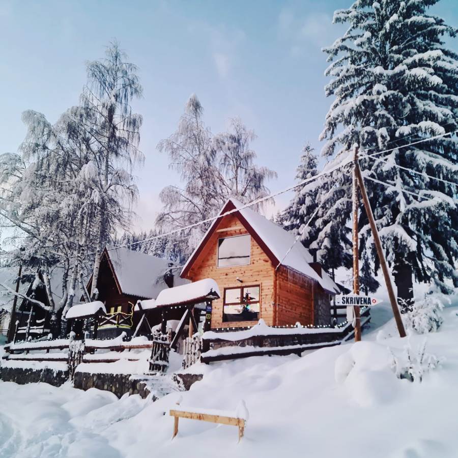 Lokve in Montenegro - a small wooden house in the snow.