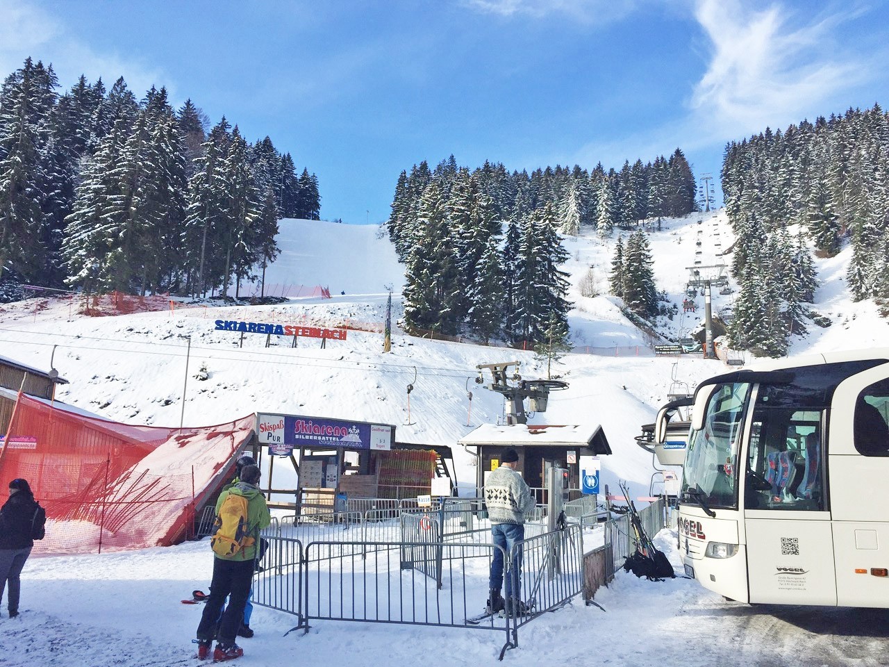 Silbersattel – Steinach in Germany - a group of people standing in the snow next to a bus.