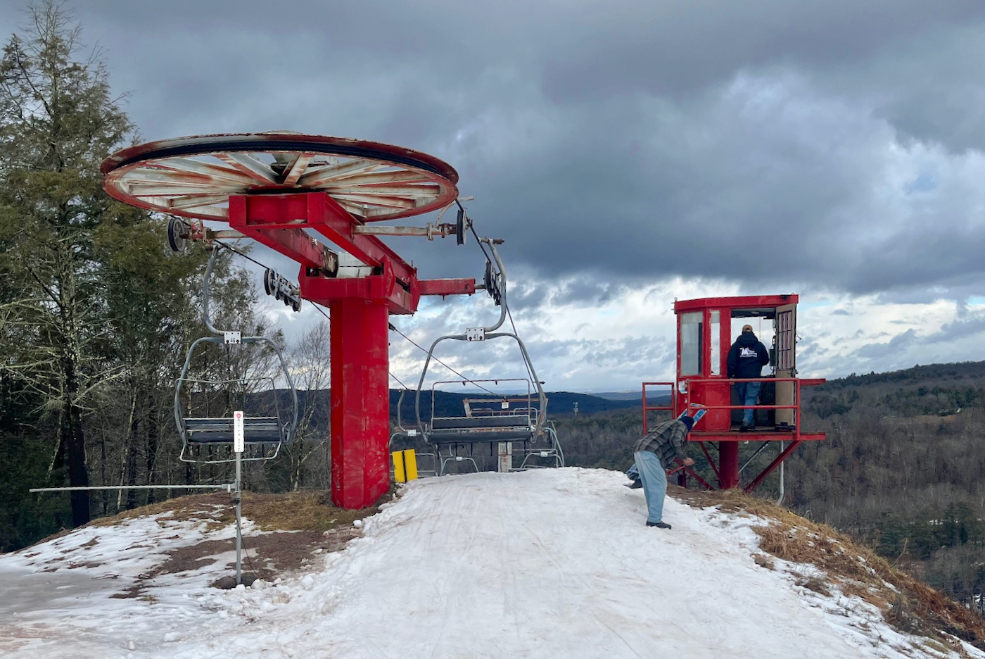 Holiday Mountain in Canada - a ski lift going up a snowy hill.