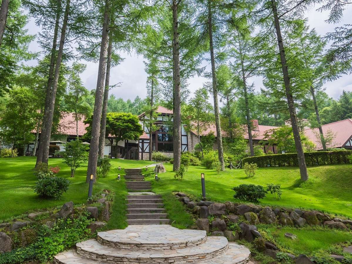 Tateshina Tokyu in Japan - a house surrounded by trees in the forest.