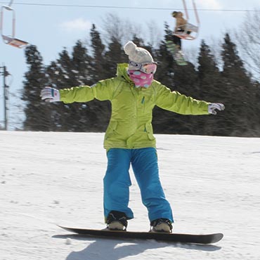 Uenono in Japan - a person on a snowboard in the snow.