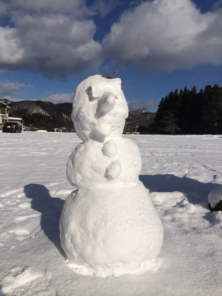 Uenono in Japan - a snowman is sitting in the snow.