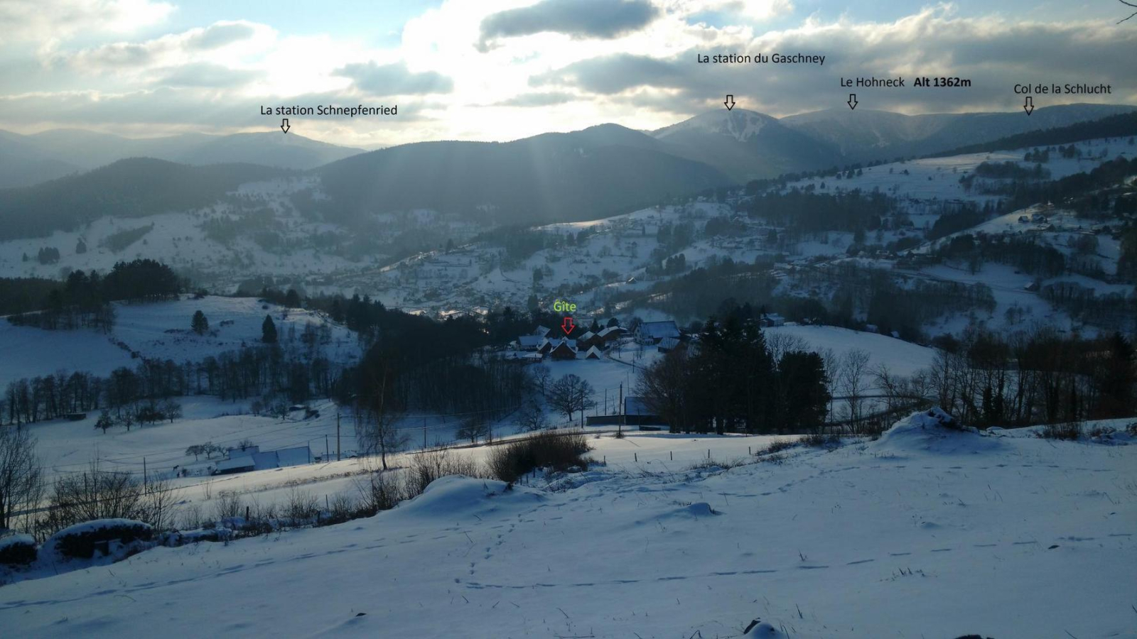 La Schlucht in France - a snowy landscape with mountains in the background.