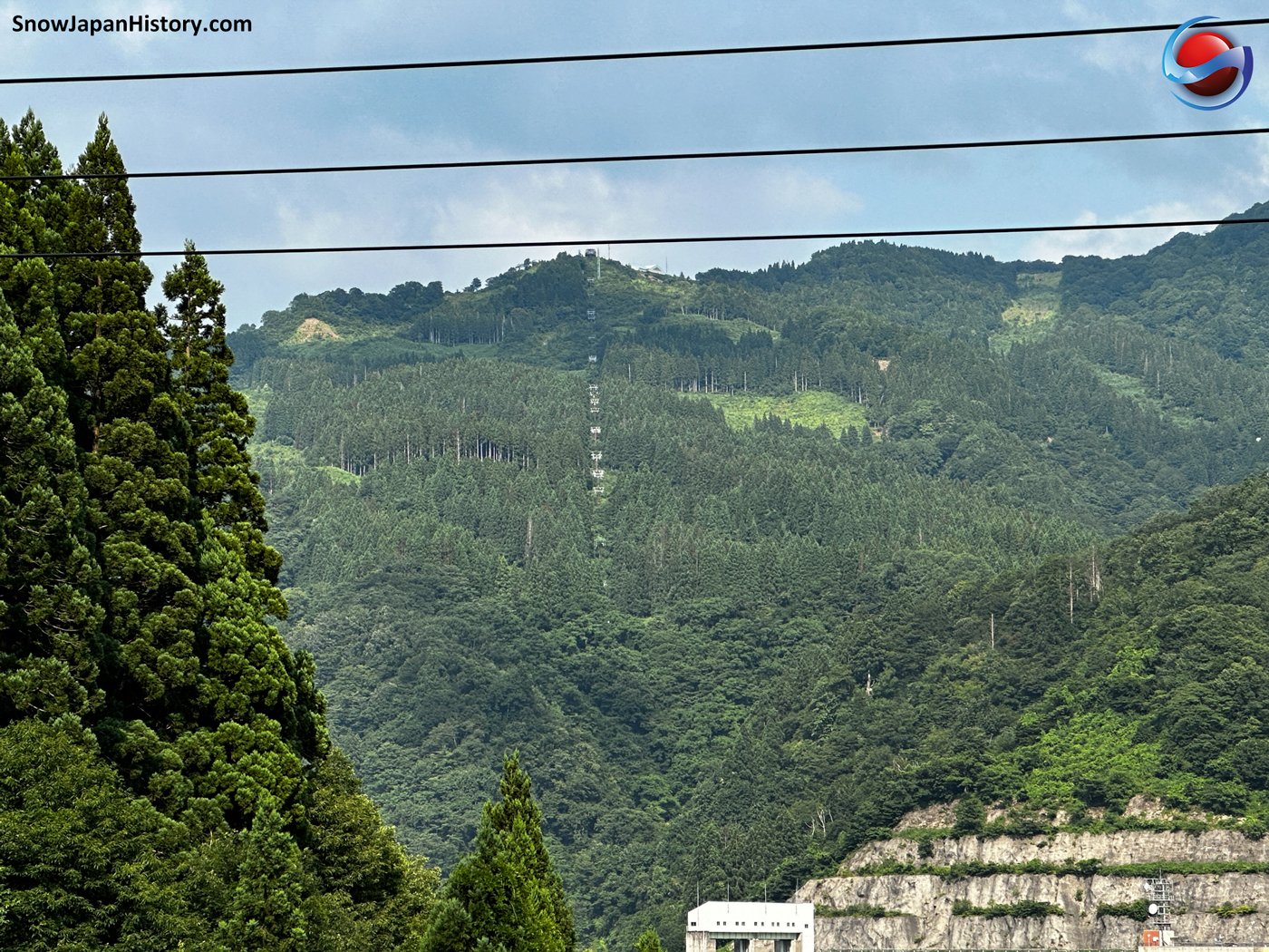 Hakusan Sena Kogen in Japan - a view of a mountain with a house in the middle.