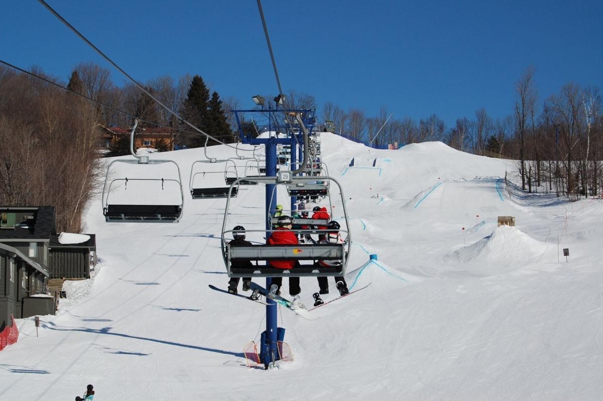 Uplands Ski Centre in Canada - a ski lift going up a snowy hill.