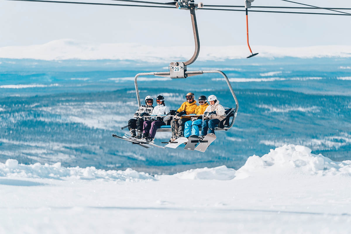 Idre Fjäll in Sweden - a group of people riding a ski lift.