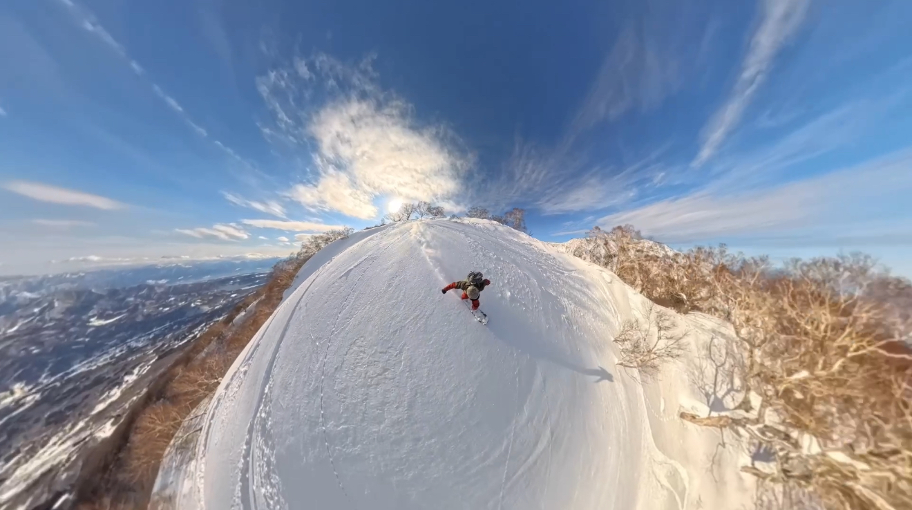 Maeyama in Japan - a person is skiing down a snowy mountain.