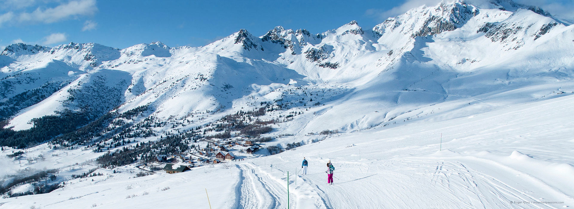 Le Grand Domaine – Valmorel | ​Doucy | ​Celliers | ​St François Longchamp in France - a person skiing down a snow covered mountain.