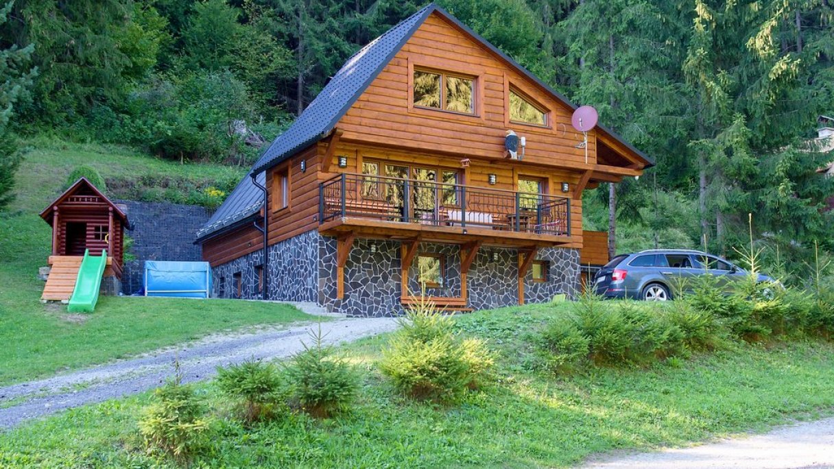 Jasenská Dolina – Belá-Dulice in Slovakia - a house with a car parked in front of it.