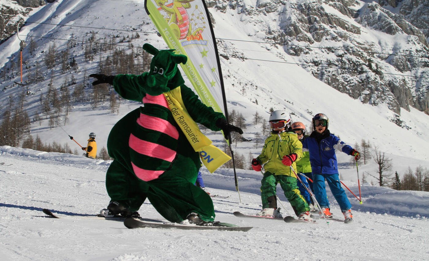 Rittisberg in Austria - a group of people riding down a snow covered slope.